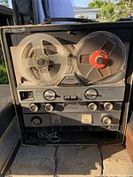 Front view of Medalist Sears reel-to-reel tape recorder showing metal reels, control knobs, and model nameplate