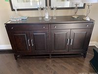 Full front view of dark brown wood cabinet showing overall design and condition