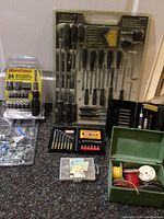 Full view of Ultra screwdriver set, Workforce ratchet bit and socket set, electrical accessories and hardware parts.