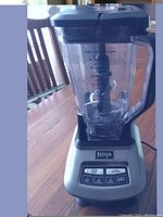 Full view of the Ninja Professional blender assembled with large pitcher on base, showing clear pitcher with measurement markings and control panel.
