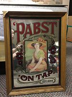 Full view of the vintage Pabst On Tap framed mirror, showing the central woman figure and text on the mirror glass inside a wooden frame.