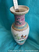 Full view of the hand painted porcelain vase showing the floral and bird design with a ruler indicating a height of 12.5 inches.