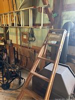 Side view of the wooden step ladder showing step spacing and structural details.