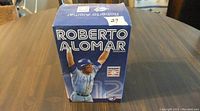 Blue Jays Roberto Alomar bobblehead box front with player image and name label.