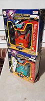 Two boxed Happy Light Dancing Cars stacked side by side, showing front view of packaging and toy images.