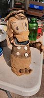 Front-facing photo of vintage standing Donald Duck cloth doll on a white tabletop, showing full body, facial details, and removable hat resting on the head.
