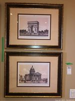 Both framed prints shown hanging on wall, Arc de Triomphe print above Pantheon print with dark frames and beige matting.