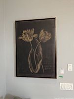Full view of the framed tulip reproduction print hanging on a wall showing size and frame