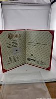 GRA certificate opened in red presentation folder