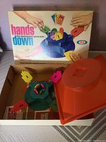 Vintage Hands Down board game including the game base, hand-shaped play markers, cards, and box with cover