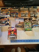 Wide shot of all cars and figures new in package with visible branding and packaging intact representing lot contents.