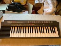 Full view of Yamaha PSR-3 keyboard showing keys and controls on top surface.