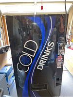 Front view showing Cold Drinks graphics and dispense opening