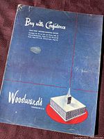 Blue cover of the Woodward's 1946-1947 catalog, with illustration of the Woodward's building in Vancouver and white text.