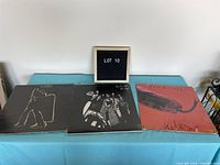 Three vinyl albums, two Alice Cooper and one T-Rex, displayed side by side with 'Lot 10' sign in background.