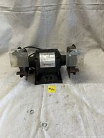 Front view of Alltrade 6 inch bench grinder showing overall condition and safety shields.