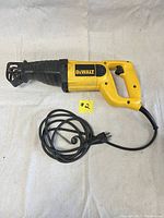 Photo of the DeWALT reciprocating saw angled to show entire tool, power cord, and D-shaped handle with trigger.