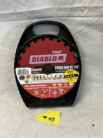 Front view of Freud Diablo stacking dado blade set in black plastic case with label showing brand, product name, cut quality claims, and project ideas.