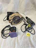 View of all three power tools: Skilsaw 7 1/4 inch circular saw, Master 3/8 inch drill, Skil 7275 sander with corded power supply