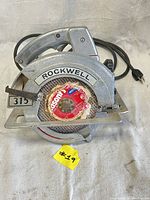 Front view of the Rockwell 315 circular saw showing the blade and the Rockwell brand label.