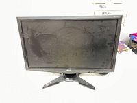 Front view of Acer 21.5 inch monitor with visible dust and marks on screen showing condition.
