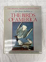 Cover of The Birds of America book featuring two birds and title.