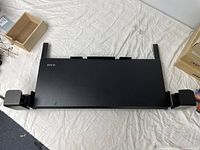 Top view of the black Vivo keyboard tray showing flat surface and mounting brackets on sides.