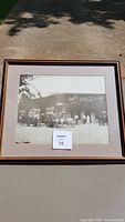 Framed vintage Joplin Bottling Coca-Cola black and white photograph showing old trucks and depot building