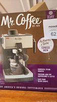Box of Mr Coffee espresso machine showing product image and features.
