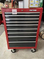 Front view showing all nine drawers, Craftsman logo, and caster wheels.