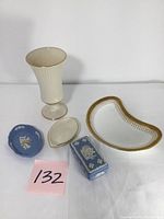 Five pieces including Lenox vase, Cauldon kidney-shaped dish, Wedgwood Jasperware blue dish with relief, matching trinket box, and small ivory tray