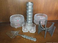 Full lot with 3 Ultima Thule cordial glasses, 4 Ultima Thule bowls, Haugrud Pewter vase, Jens Quistgaard Fiesta cast iron candelabra, and David Andersen cheese slicer