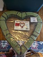 Photo of a large 18-inch heart-shaped Never-Wilt Deluxe Snap-Fit floral foam frame in green, shrink-wrapped.