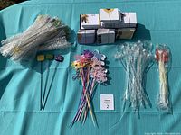 Complete overview of all flower arrangement picks, note card holders, and stacked small note cards, showing quantity and variety