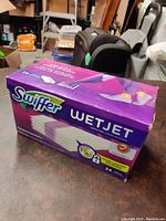Box of Swiffer WetJet floor cleaning pads showing the full packaging and branding.