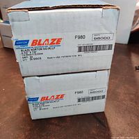 Two white boxes labeled Norton Blaze sanding discs, each box contains 25 discs.