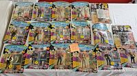Lot displaying all 17 Star Trek The Next Generation action figures carded and sealed, with various characters posed in clear blister packaging attached to colorful cards
