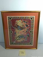 Full view of framed Australian Aboriginal mixed media art showing kangaroos and human figures on earth tone background with dotted patterns.