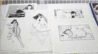 Six black and white signed art prints arranged on a flat surface. Four are Steve Woron illustrations of nude women, one is a Jean Kluge signed lithograph, and one is a Maria Cervantes signed Betty Page print. The largest print measures approximately 17.5 by 22.5 inches.
