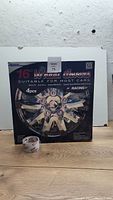Front of the original packaging showing the 16" wheel cover image and quantity (4 pieces)