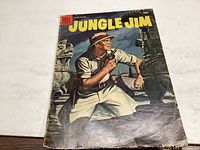 Front cover of Jungle Jim comic showing explorer man with pistol, jungle background, some creasing and edge wear visible.