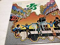 Front cover of the vinyl record featuring The Jackson Five performing on stage with a colorful psychedelic background.