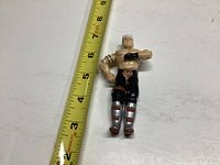 Front view of GI Joe Road Pig action figure next to measuring tape showing approximately 4 inches in height