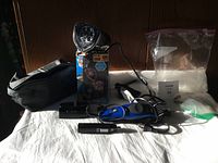 Full lot overview showing electric hair trimmers, Paw Patrol light, grooming pouch, and accessories