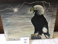Front view of the painting depicting a bald eagle with stormy sky and lightning, signed by Whitecrow.