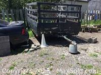 Front and tongue hitch view of the trailer parked on grass