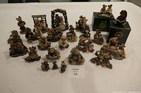 Group view of all twenty-five Boyds Bears and Friends collectibles arranged on white surface showing various characters and themes.