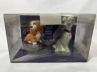 View of Lady and Tramp salt and pepper shakers in original clear plastic packaging showing the box design and product label.