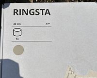 Close up of the box label showing brand IKEA, model RINGSTA, and size 42 cm (17 inch) diameter.