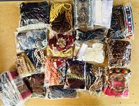 Overview of all bags containing assorted ribbons, trims, and cords